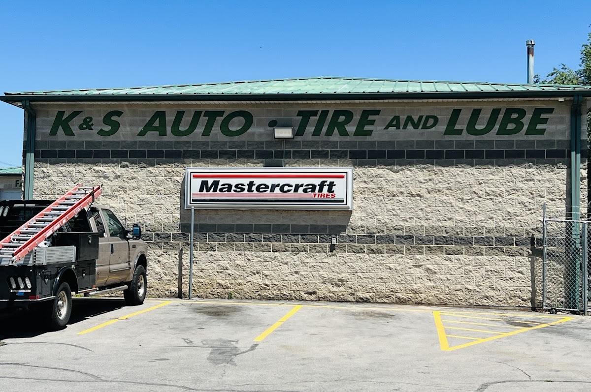 The K&S Auto Tire and Lube sign on the shop wall in Lehi